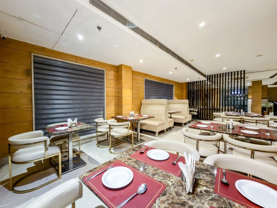 Marble-top tables set for service at Sakun, Hotel Sawera Grand, Amritsar