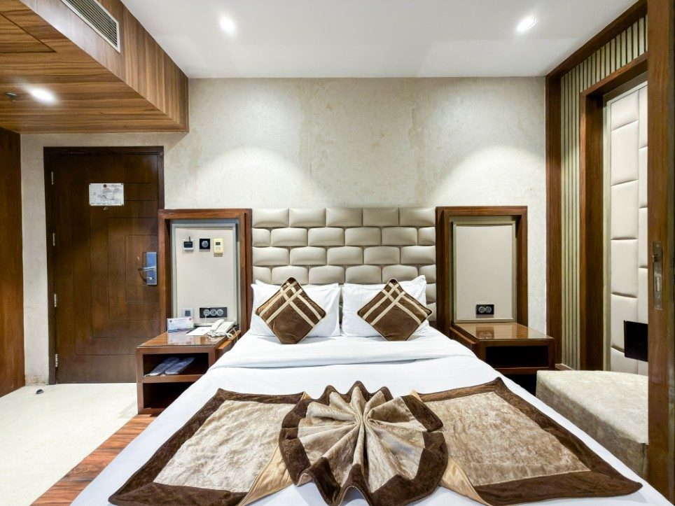 The quilted cream headboard wall of the K L Suite, Hotel Sawera Grand, Amritsar